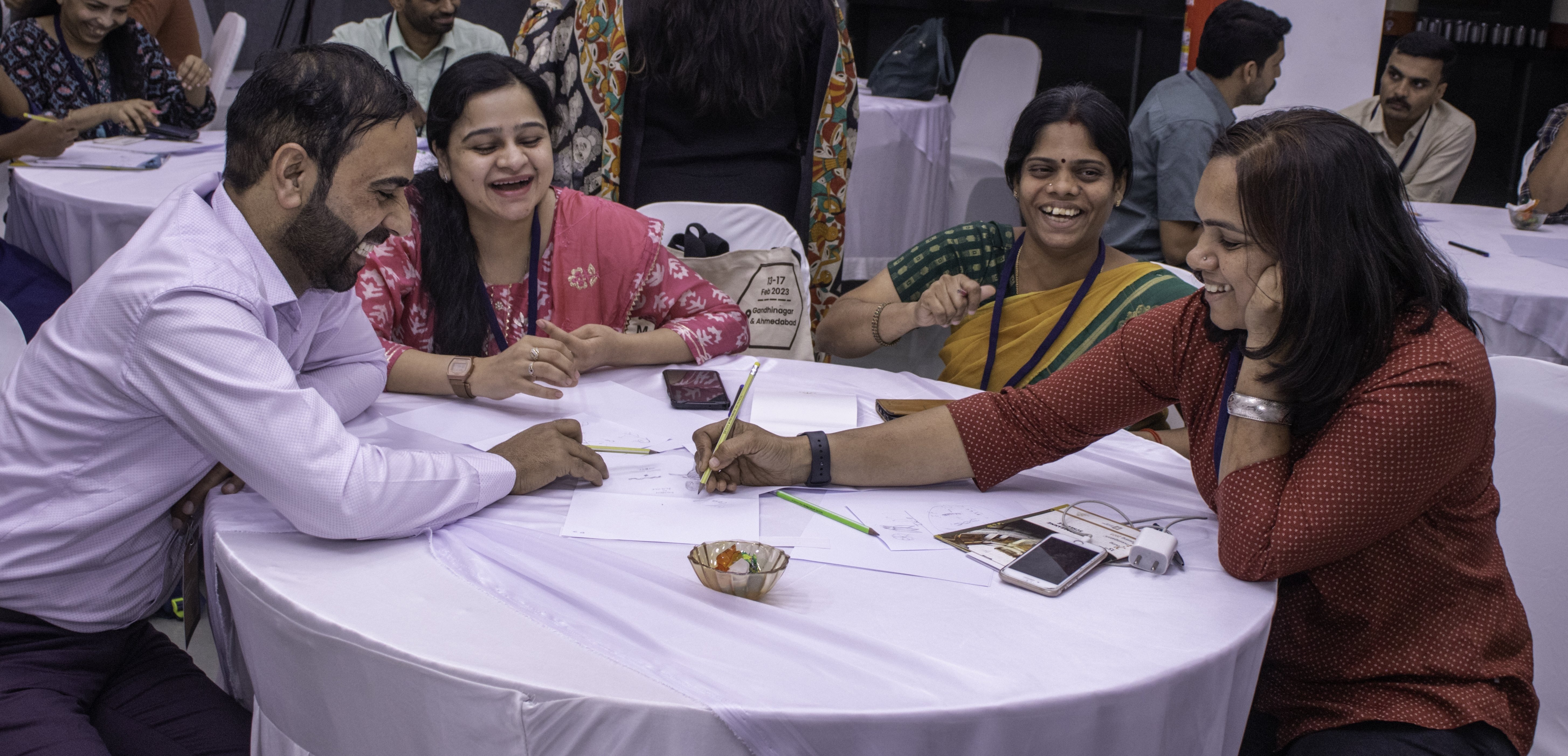 Participants discussing their drawings in a group