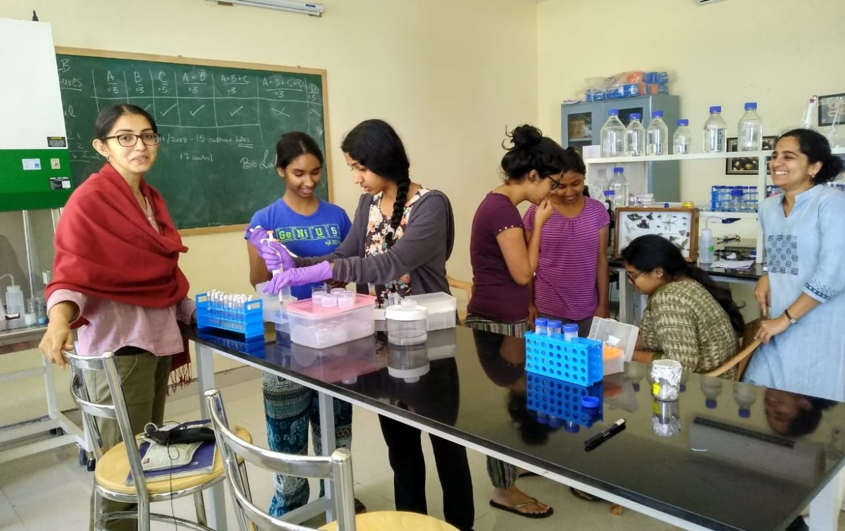 Sravanti Uppaluri, extreme left, and Divya Uma, extreme right with undergrad students in the Biology lab at Azim Premji University, Bangalore